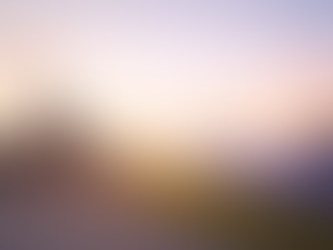 Solar panels generating renewable energy in a field at sunrise, with industrial smokestacks and cooling towers emitting smoke in the background.