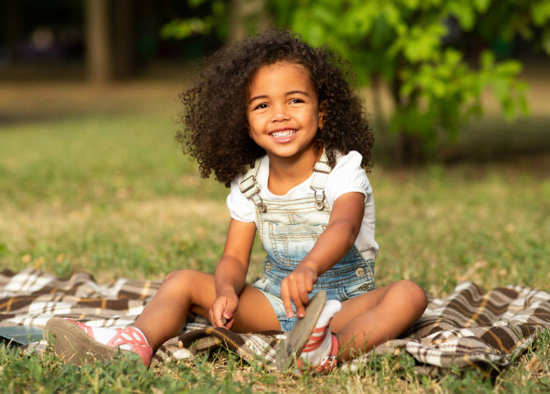 Acquired brain injury - Neurokids - young girl smiling in a garden.jpg