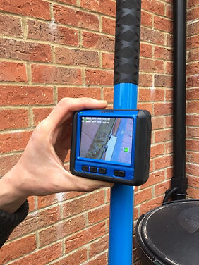 Using a camera to check for debris in the gutters
