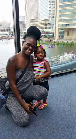 Wife and daughter having fun at the Baltimore Aquarium