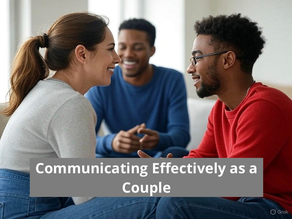 Communicating as a Couple can be daunting. In this image, a therapist sits back while a couple is trying to communicate effectively with one another. They sit toward each other, eyes locked, holding hands.
