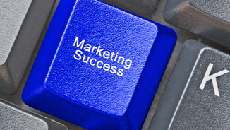 Blue keyboard key labeled "Marketing Success" stands out among gray keys, symbolizing achievement and strategy in a digital setting.