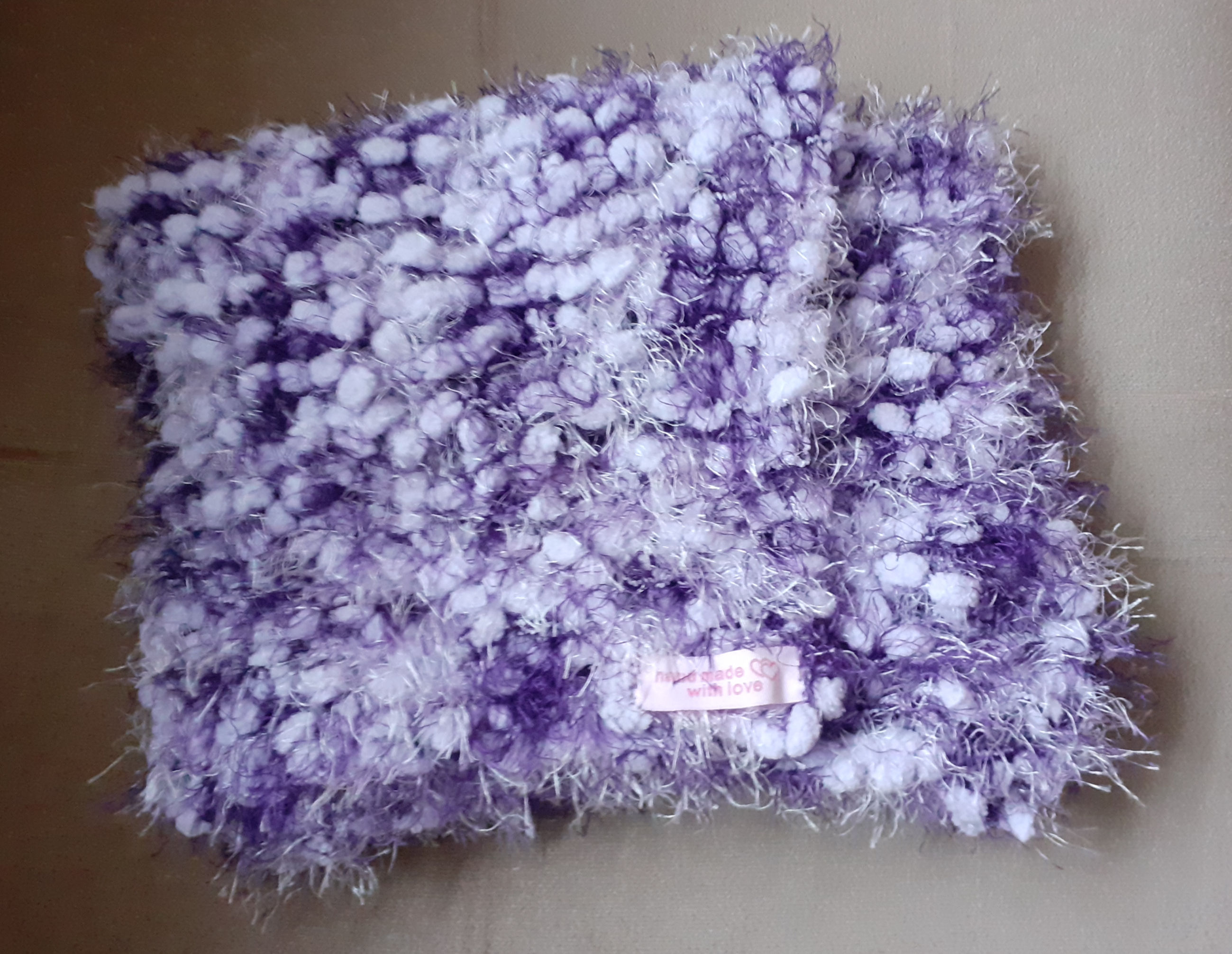 Purple and white chunky and fluffy scarf hand-knitted in pom-pom yarn