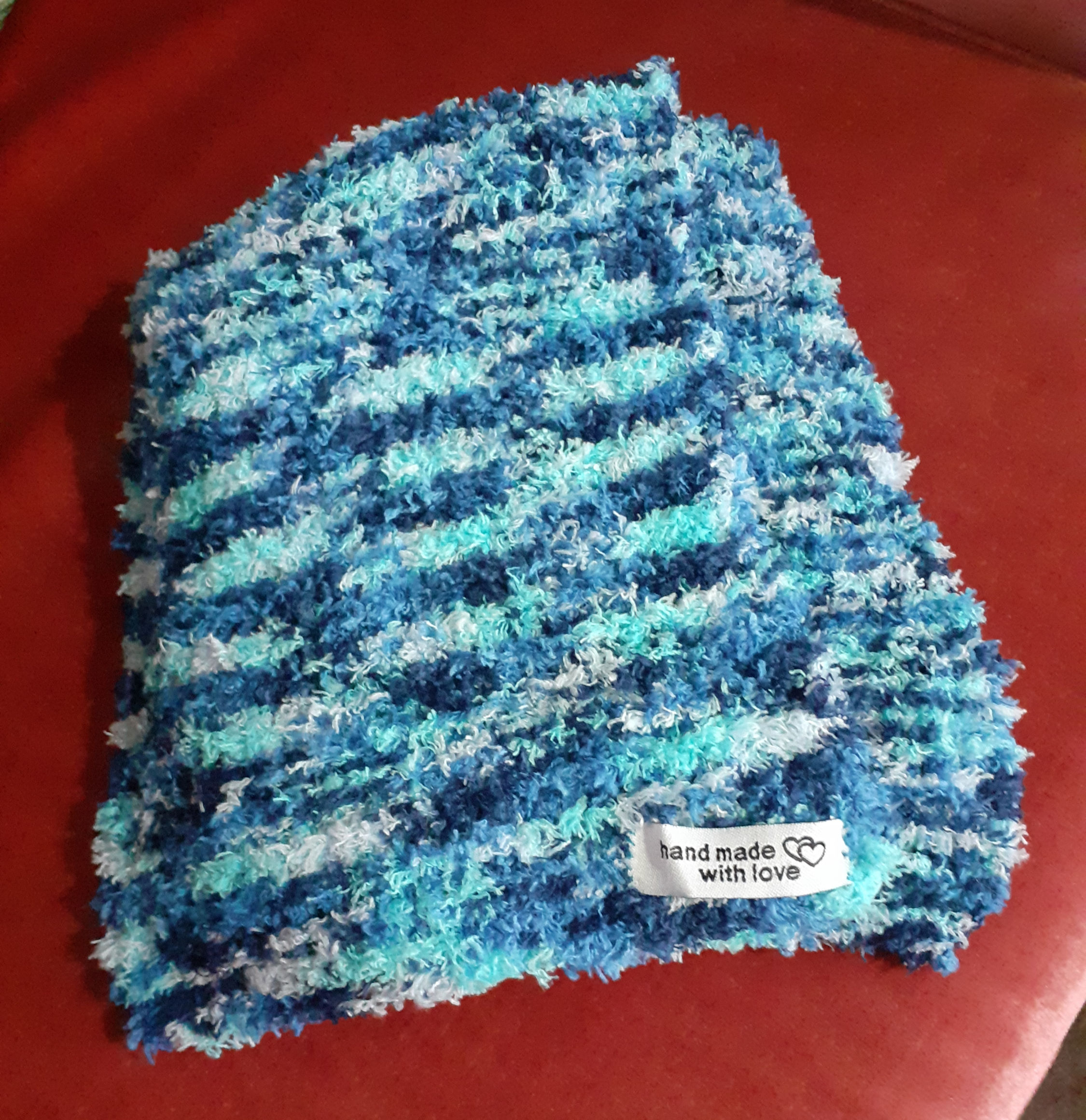 Gorgeously soft scarf hand-knitted in shades of blue and white