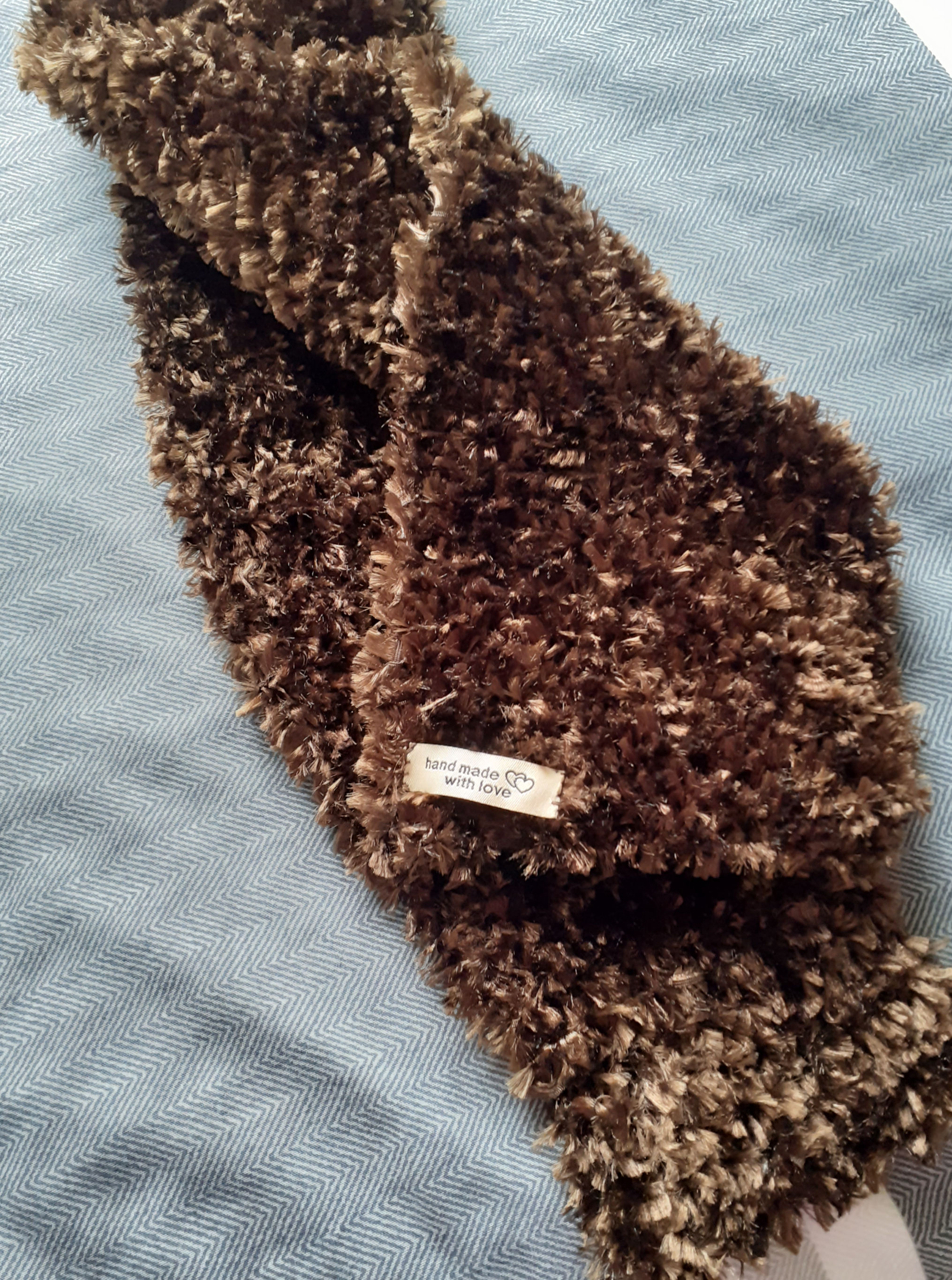 Brown scarf hand-knitted in eyelash yarn