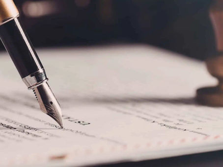 A fountain pen signing a legal will