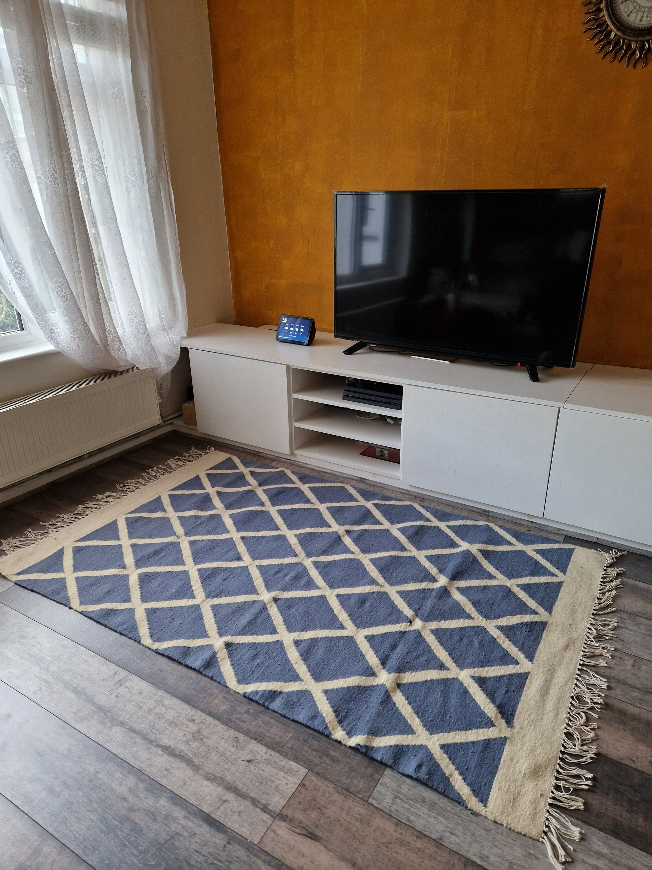 Cross current: blue and beige checkered Kilim rug