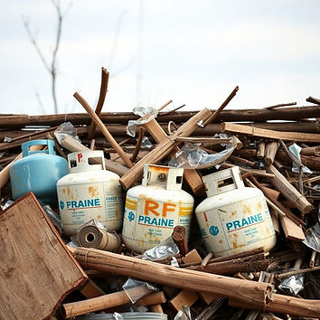 propane, broken glass, wood, trash, in pile.jpg
