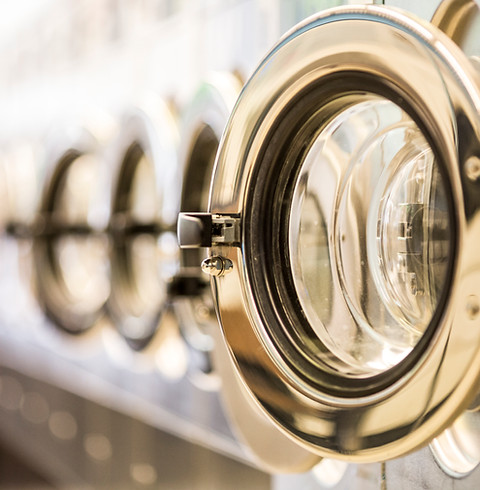 Laundrette with washing machine doors open