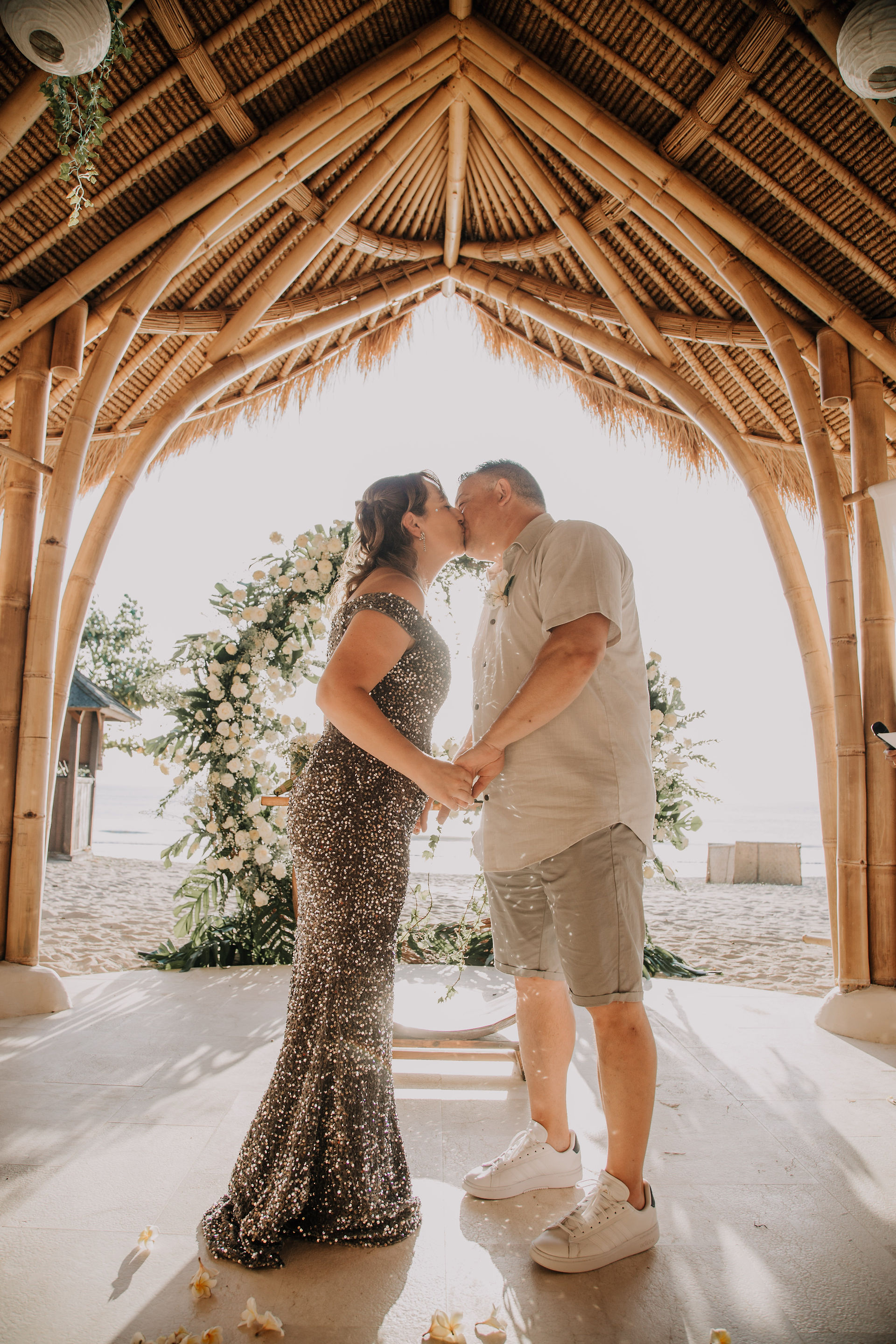 Tying the knot inside Bamboo Pavilion by the beach in Jimbaran Bay, Bali