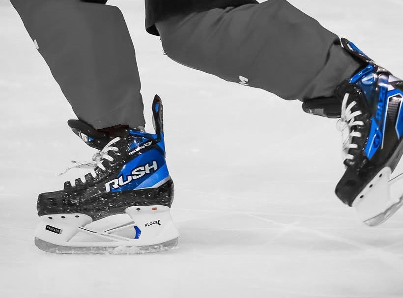 Eye-level view of RUSH RAZOR R4 PRO hockey skates displayed on a store shelf