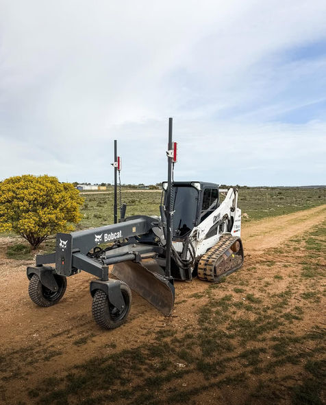 Bobcat with grader attachment for equipment hire and earthmoving in the Mallee