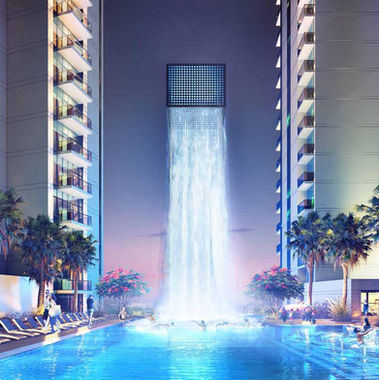 Luxury Apartments for sale in Golf Gate Dubai |  intergolden house real estate | Podium Level with fountain night time