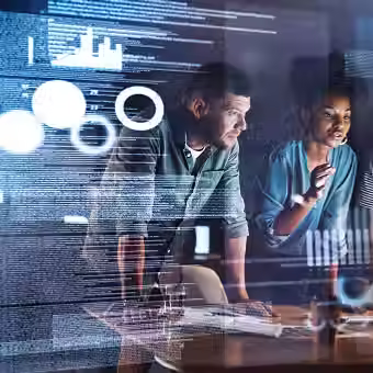 Corporate team collaborating with AI-driven dashboards, illustrating A.R.T.I.’s cognitive co-pilot role in compliance, strategy alignment, and real-time analytics.