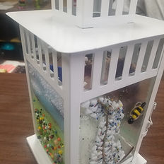 White lantern with glass panels, floral designs, and fused glass details. MargiesArtGlass.