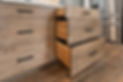 Custom wood cabinet drawers with black sleek hardware