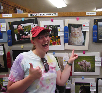 Kate Holley at Montana State Fair in front of winning photo