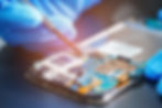 01-30-2025_-_Blue_Gloves_Repairing_cell_phone.jpg