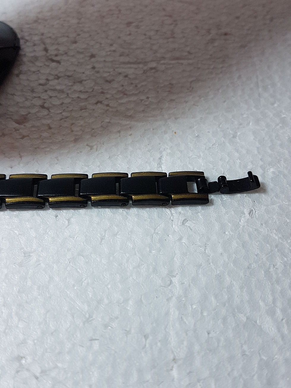 Miniatura: Bracciale nero acciaio bordi oro