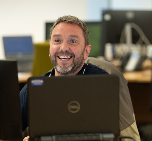 Social worker sat at computer