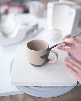 Woman Painting Pottery