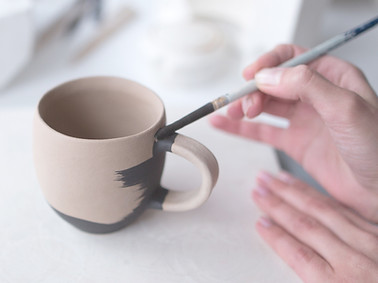 Woman Painting Pottery