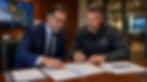 Construction surety underwriter reviewing WIP report for surety with contractor