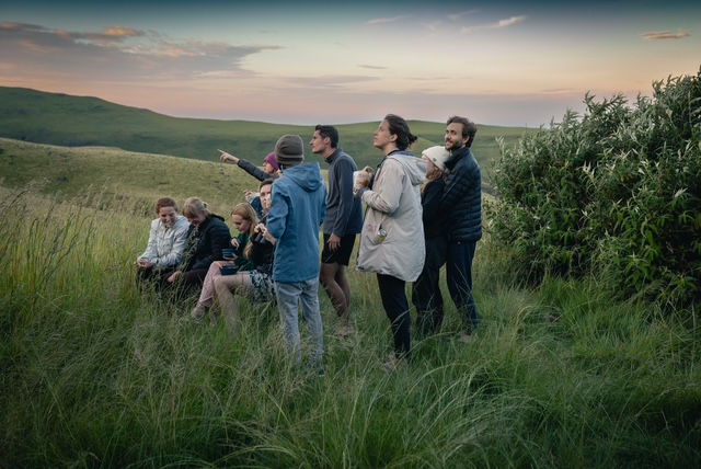 Enjoying the entertainment of the day as Mike ascended to the cave