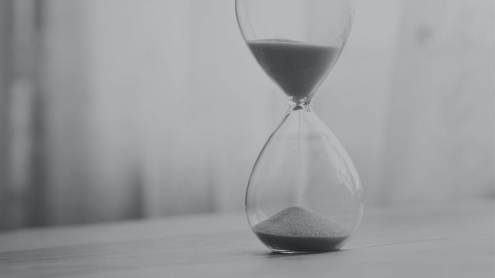 Hourglass representing attention management vs time management at work