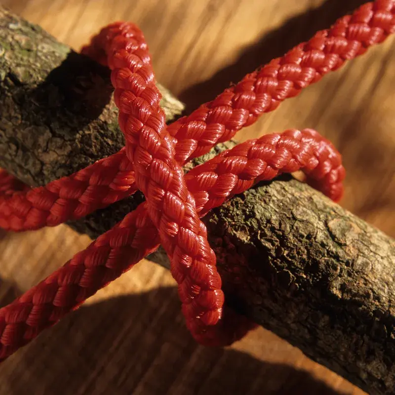 A close up view of a simple clove hitch to attach a rope to an object