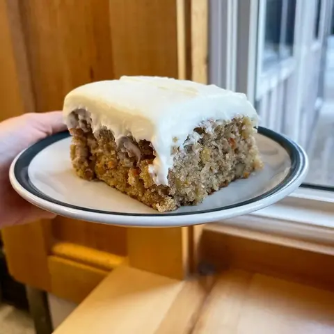 a slice of frosted cake