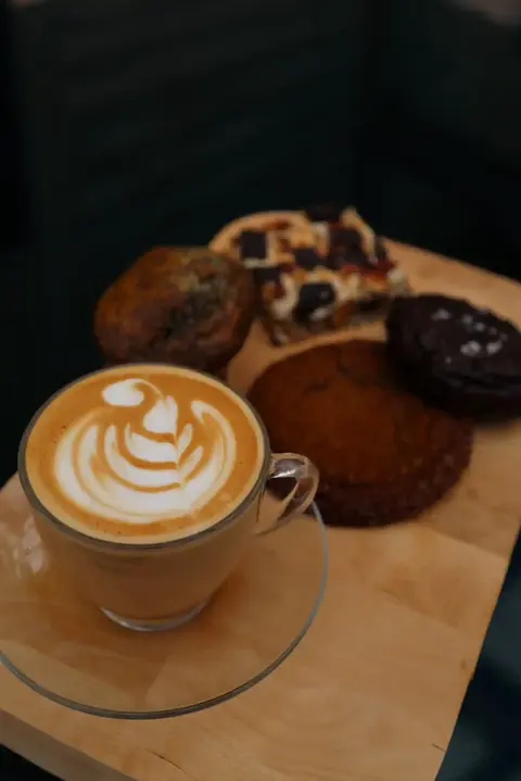 coffee drink with plate of desserts