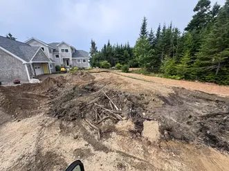 excavated area where the driveway will be expanded