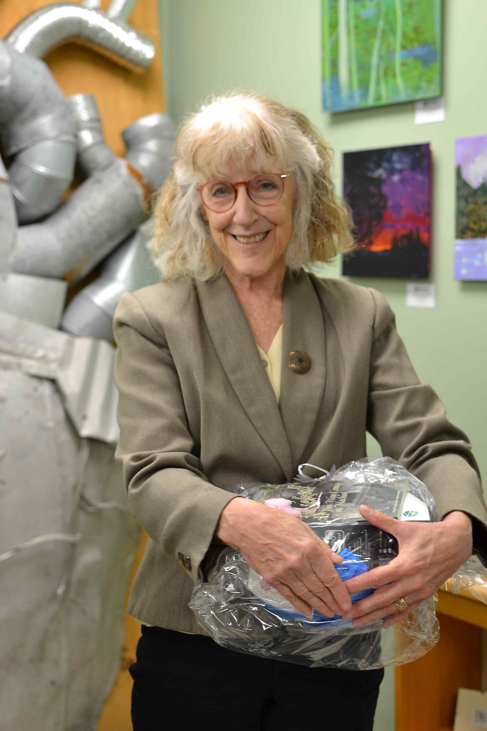 First Place Winner: Cathy McKelway holding her prize package