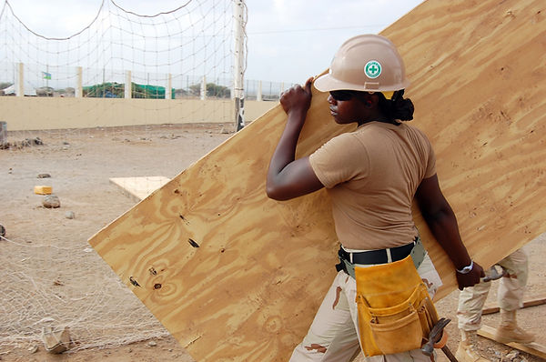 Canva - Construction Worker Carrying a P