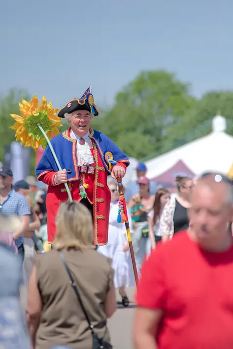 candid photograph of a man in costume at the hertfordshire county show