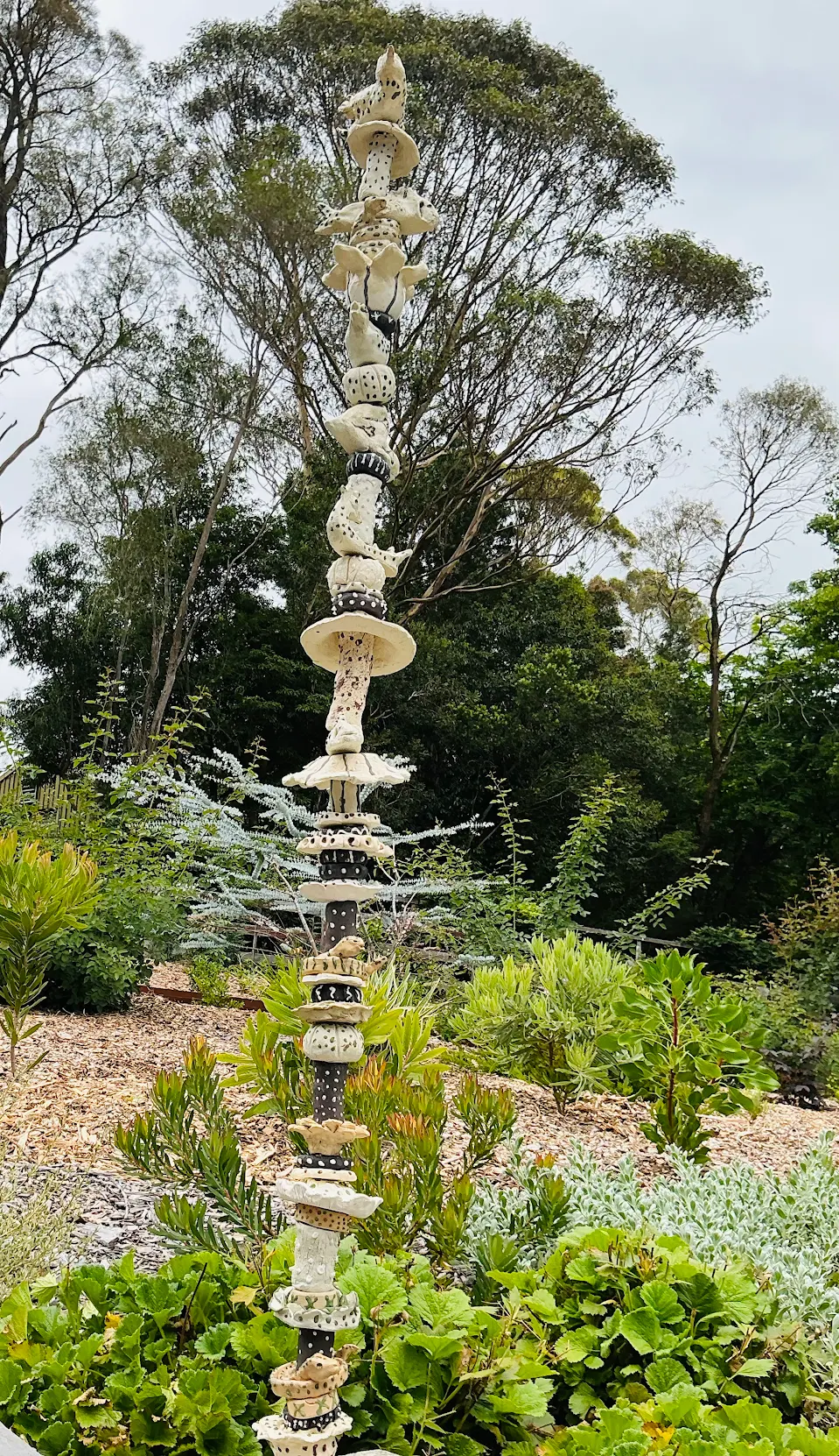 Stack of ceramic beads like a totem pole in a garden