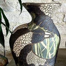 A vase with magpie decoration