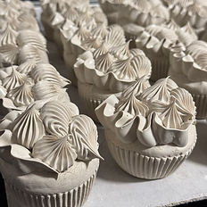a tray of porcelain cupcakes