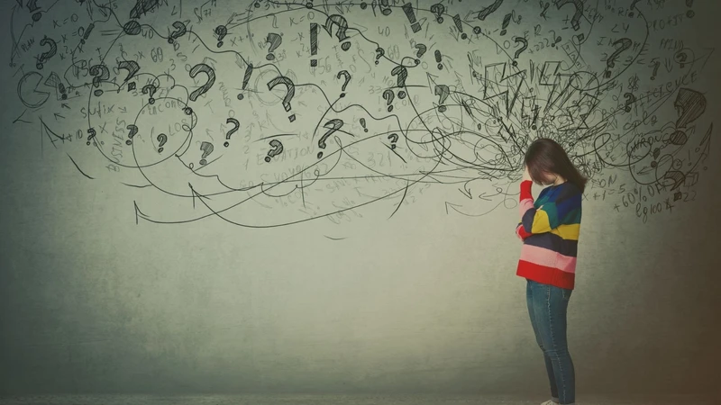 Young teenager with multicolored lines chaotically centered around their head