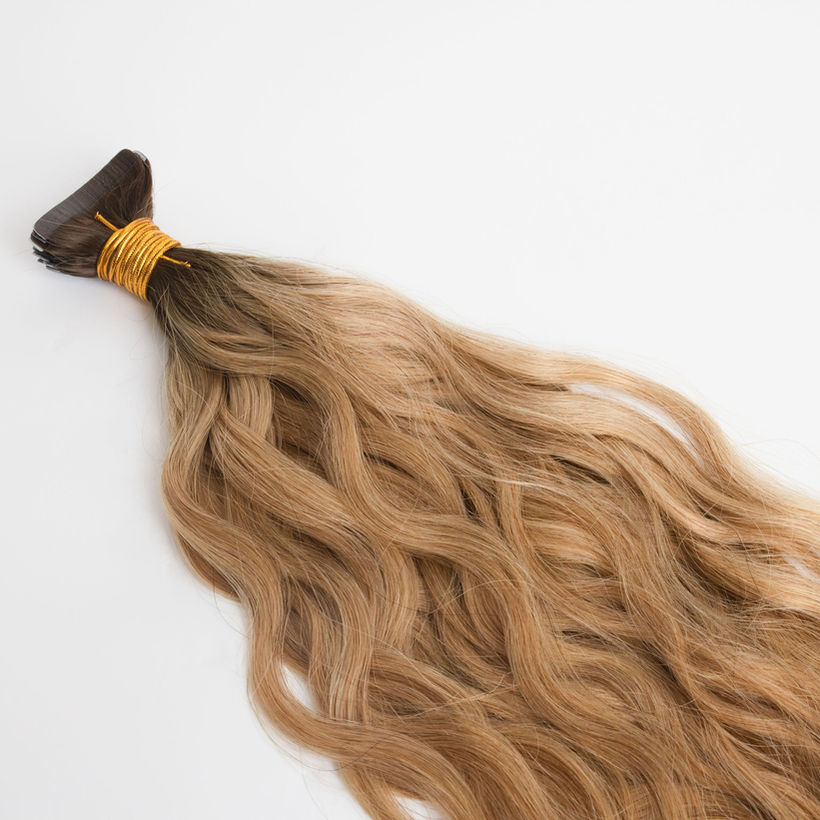 Studio Techilo dark blonde wavy dark rooted tape in extensions close up