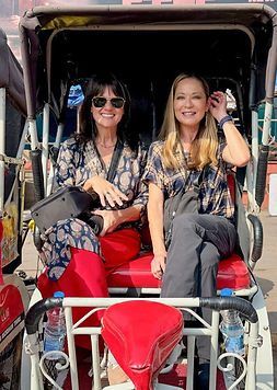 Two women in a rickshaw