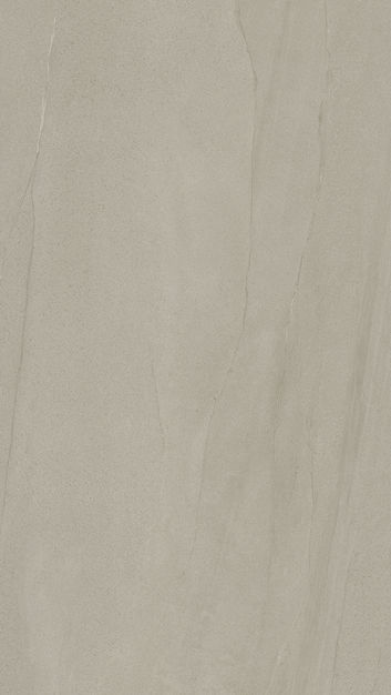 Subdued beige large format Spanish Sandstone porcelain tile with fine veining.