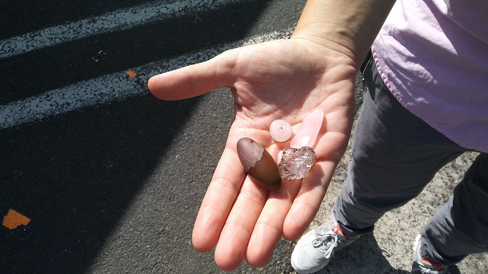 Figure 2: Owner of Audrey Long Ceramics, Audrey Long, with a handful of goodies including a chip of quartz and a Shiva stone.