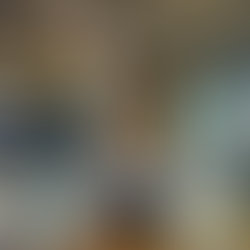 A volleyball player jumps to hit the ball over a net in an indoor court. She's wearing a jersey with number 1, showing focus and action.