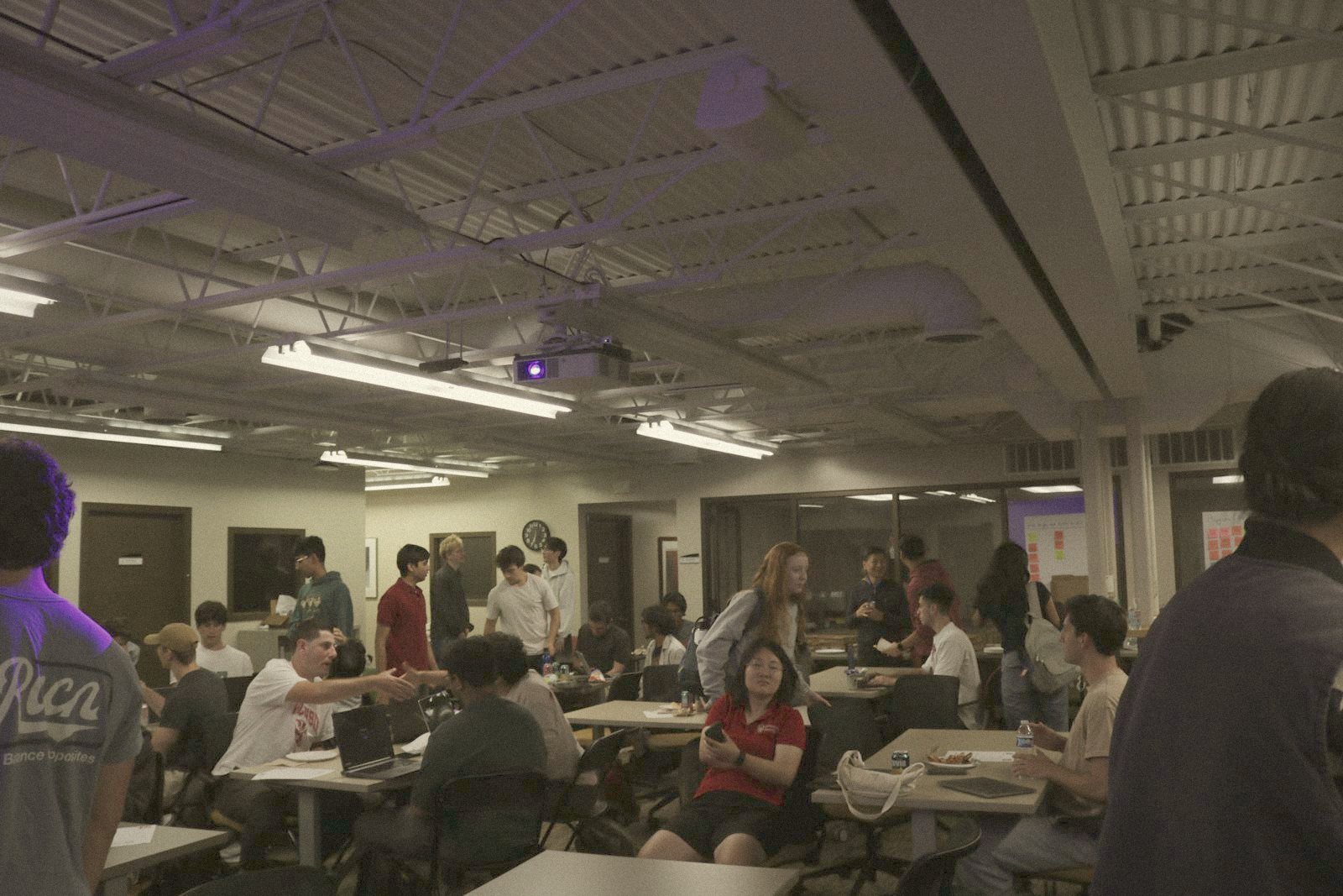 Students mingling at tables after the talks