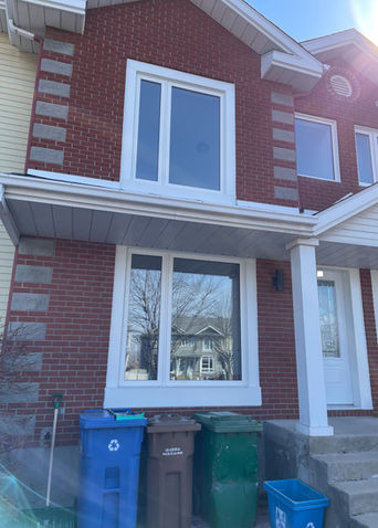 Sleek modern windows installed in a Candiac home, offering enhanced energy efficiency and stylish design.