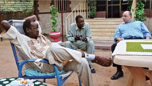 "Going to the Guns: Heilberg confers with Gen. Paulino Matip (left) and his son Gabriel at the general's compound in Juba. 'He’s a capitalist,' Heilberg says. 'He understands that l deserve to make a profit'”, "Will Global Warming, Overpopulation, Floods, Droughts and Food Riots Make This Man Rich", Photographed by Jen Warren, Rolling Stone, Issue 1105, May 27, 2010