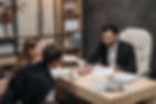 male-lawyer-with-clients.jpg