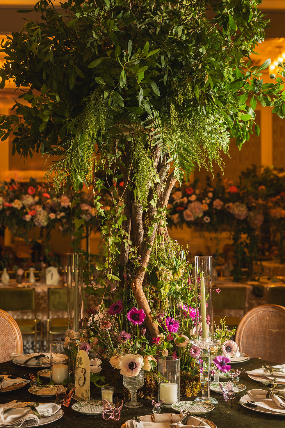 Quinceañera floral centerpiece with candles and greenery at the Dr. Phillips Center, Orlando